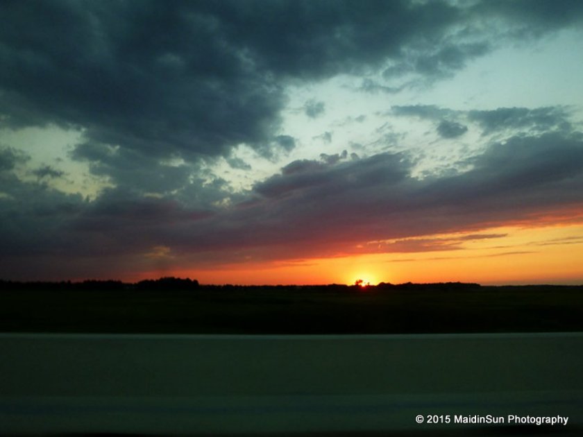 Sunset was beautiful last night, but I had to admire it from a moving vehicle.